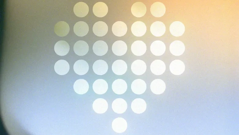 Ett grafiskt hjärta uppbyggt av punkter.